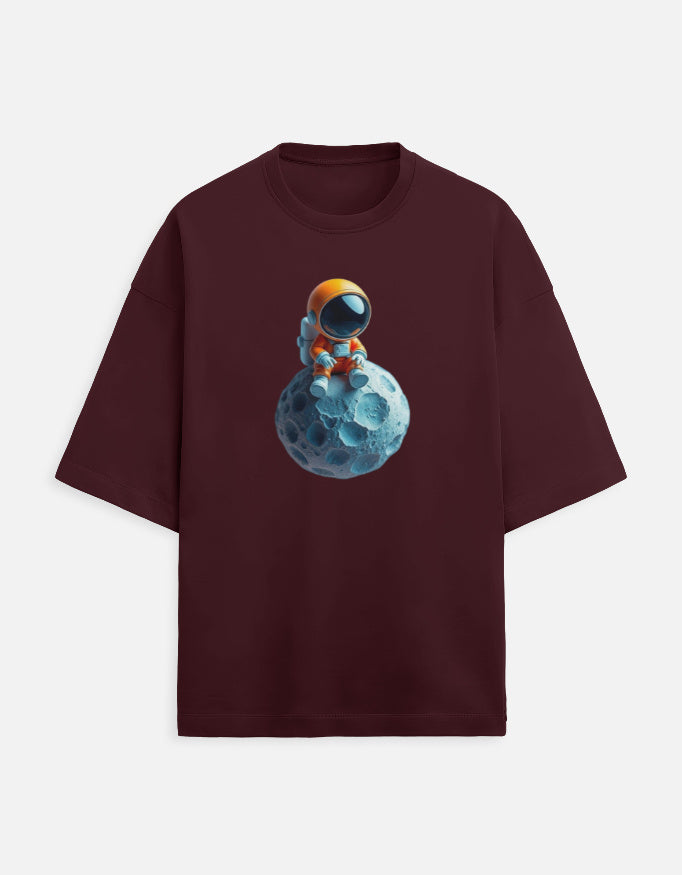 Burgundy t-shirt with cartoon astronaut sitting on blue moon graphic