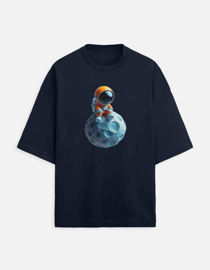 Navy t-shirt with cartoon astronaut in orange suit sitting on a blue asteroid graphic