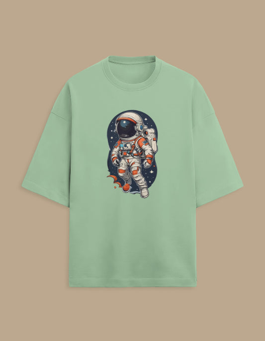 Mint green t-shirt with astronaut graphic in outer space, trendy space-themed apparel