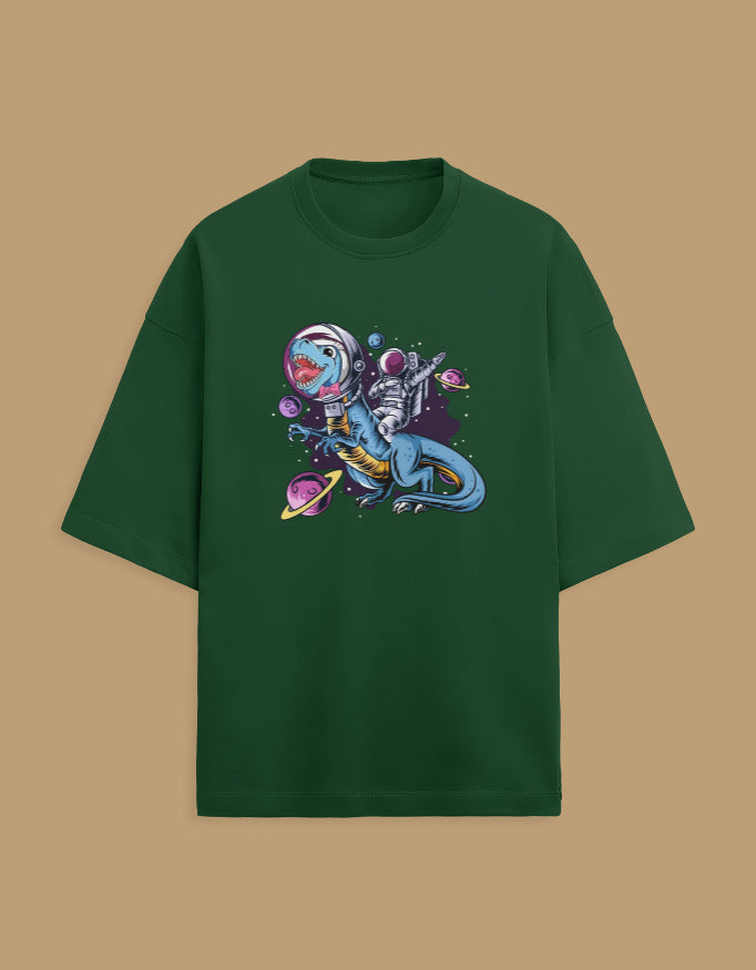 Green t-shirt with astronaut riding a dinosaur in space graphic and colorful planets