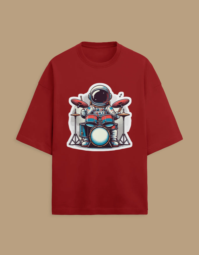 Red t-shirt with cartoon astronaut playing drums graphic, casual space-themed apparel
