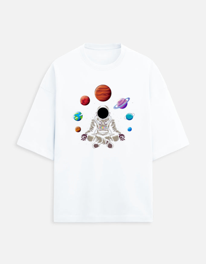 White t-shirt with graphic of meditating astronaut and colorful planets