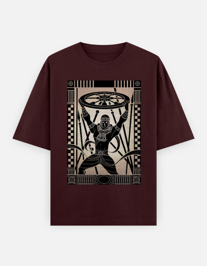 Unisex oversized burgundy t-shirt with Egyptian wheel figure graphic