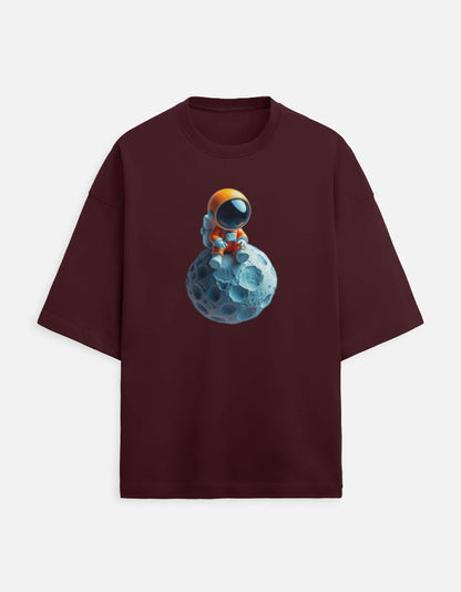 Burgundy t-shirt with cartoon astronaut sitting on blue moon graphic