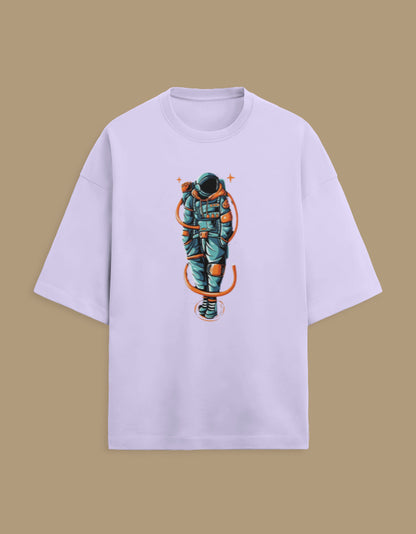 Oversized light purple t-shirt with colorful astronaut graphic on beige background