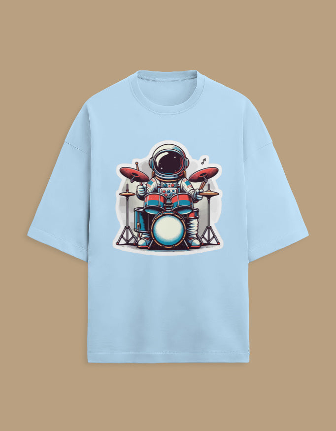 Light blue t-shirt with cartoon astronaut playing drums graphic