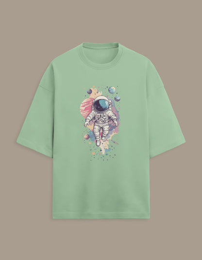 Mint green t-shirt with astronaut and colorful planets graphic print on front