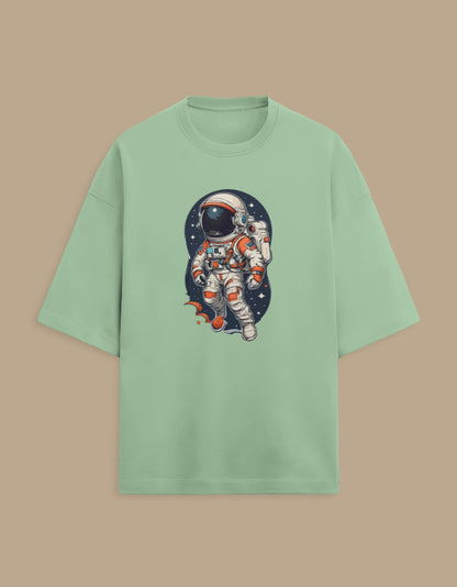 Mint green t-shirt with astronaut graphic in outer space, trendy space-themed apparel