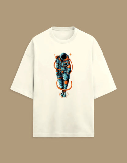 Beige t-shirt with colorful astronaut graphic, streetwear style on a brown background