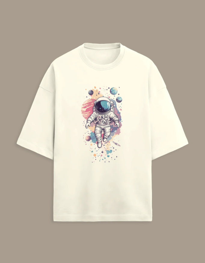 Beige t-shirt with colorful astronaut and planets graphic on front, space art clothing