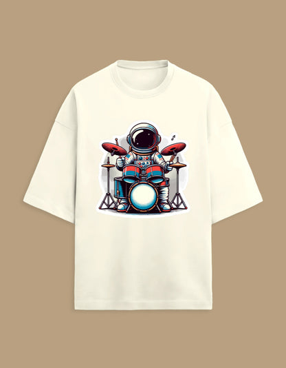 Cream t-shirt with astronaut playing drums cartoon graphic, music novelty tee