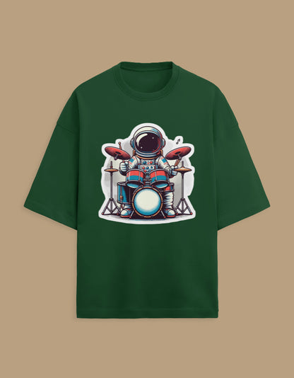Green t-shirt with astronaut playing drums cartoon graphic on front