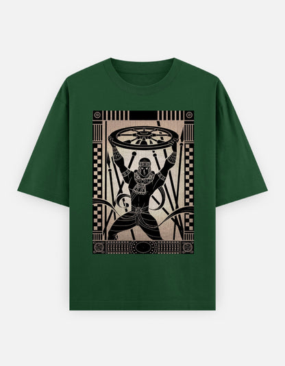 Unisex oversized green t-shirt with black stylized figure holding wheels graphic