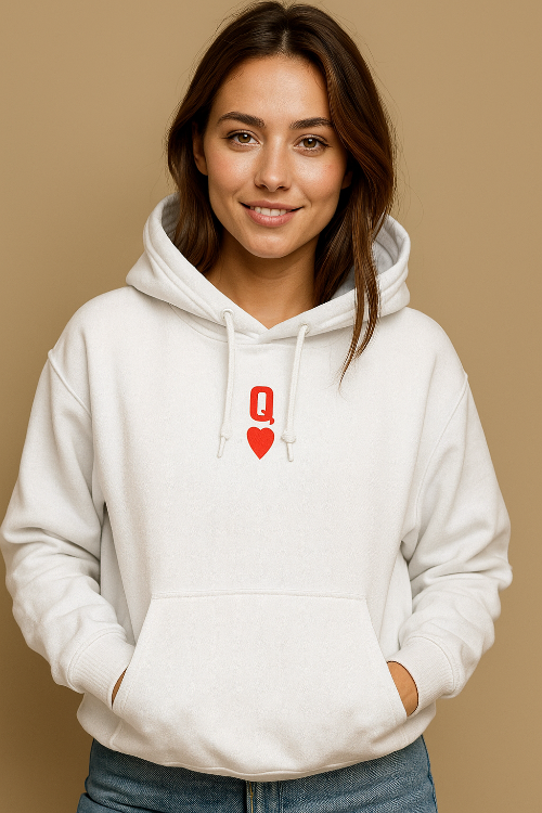 Woman wearing a white hoodie with a red Queen logo on a beige background