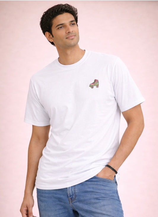 Man wearing a white t-shirt with a small logo on a light pink background