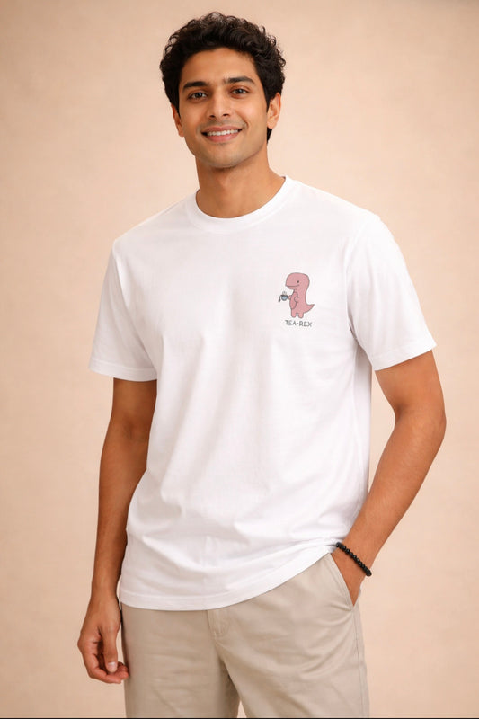 Man wearing a white t-shirt with a small graphic on a beige background