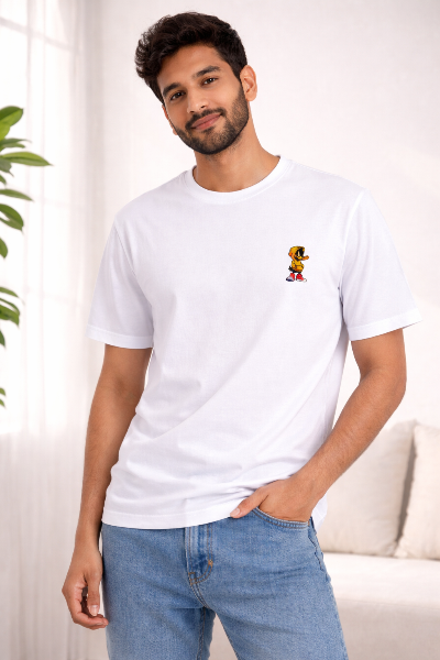 Man wearing a white t-shirt with a small embroidery on a light background